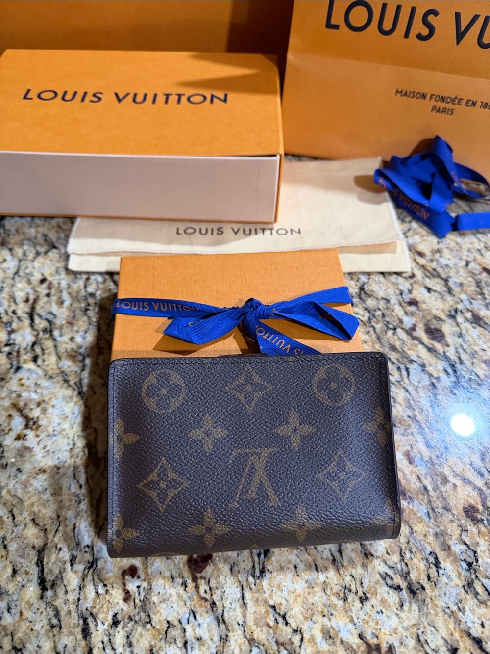 New in Box woman’s Louis Vuitton monogram Juliette wallet pink accents